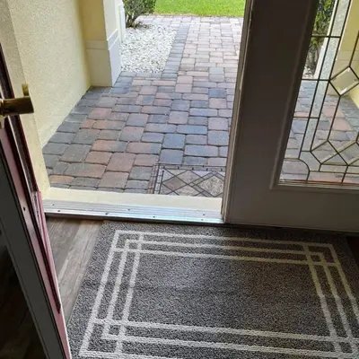 an open door with a rug in front of a walkway at NEW King Bed Glow In The Dark Kid Cave in Kissimmee