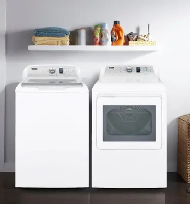 a stove and a washer and dryer in a kitchen at NEW London House Orlando Airport Private Condo in Orlando