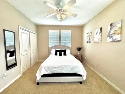 a bedroom with a bed and a ceiling fan at Modern Apt in Lake Nona, 10min to ORL Airport in Orlando