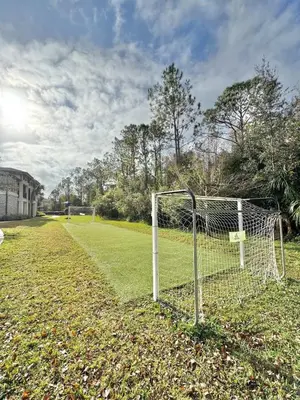 a soccer field with a net in the grass at Modern Apt in Lake Nona, 10min to ORL Airport in Orlando
