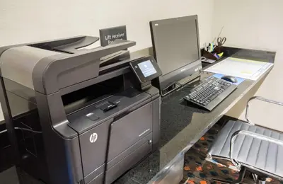 an office with a printer and a computer on a desk at Hampton Inn & Suites Orlando near SeaWorld in Orlando