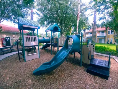 a playground with a slide and other playground equipment at Spectacular Lake View - Game Room- Close to Disney in Kissimmee