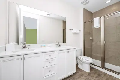 a bathroom with a toilet and a sink and a shower at Coastal Haven Villa Near Disney With Margaritaville Resort & Island H20 Waterpark Access - 2964Or in Orlando