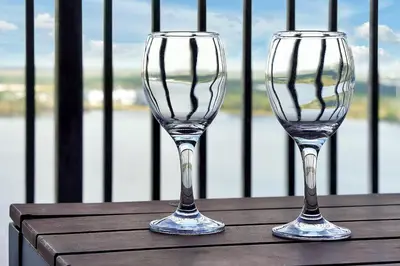 two empty wine glasses sitting on top of a table at Living the Disney Dream! Lake View Luxury Condo in Orlando