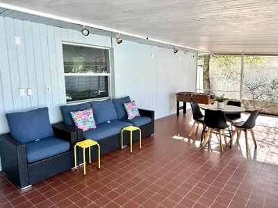a living room with a couch and chairs and a table at Orlando Luxe Retreat with Private Pool in Orlando