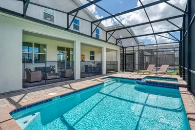 a swimming pool in a house with a glass ceiling at 6Q/6B | Piscina Privativa | Game Room Temático in Kissimmee