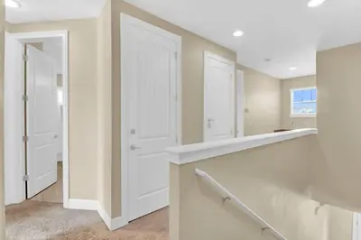 a kitchen with white cabinets and a white door at Relaxing 6BR Home w Pool Near Disney in Orlando