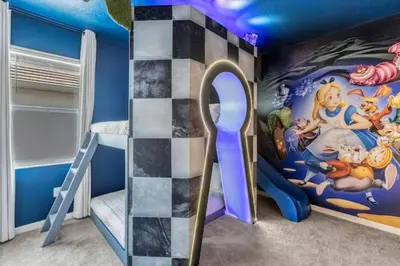a childs bedroom with a disney mural at Beautiful and cozy at Veranda Palms in Kissimmee