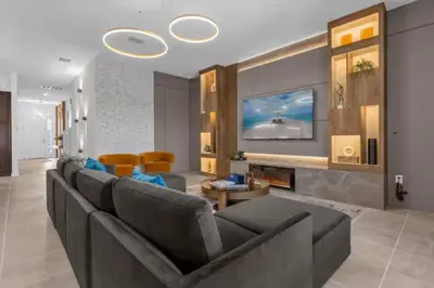 a living room with a couch and a fireplace at Beautiful and cozy at Veranda Palms in Kissimmee