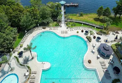 an overhead view of a large swimming pool next to the water at Orlando Blue Heron 1 Mile From Disney 2nd floor in Orlando