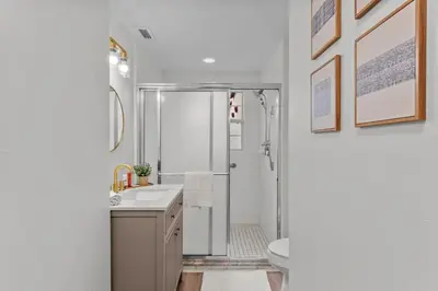 a bathroom with a shower and a sink and a toilet at SUPER BOHO - LAKE TOHO FISHiNG CIVIC CeNTER in Kissimmee