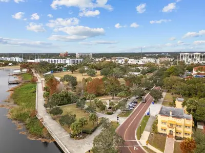 an aerial view of a city with a river and buildings at SUPER BOHO - LAKE TOHO FISHiNG CIVIC CeNTER in Kissimmee