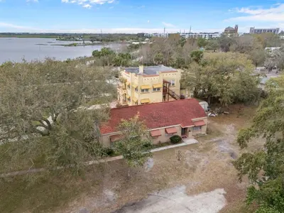 an overhead view of a house with a red roof at SUPER BOHO - At Lake Toho Fishing VINTaGE VIBEs in Kissimmee