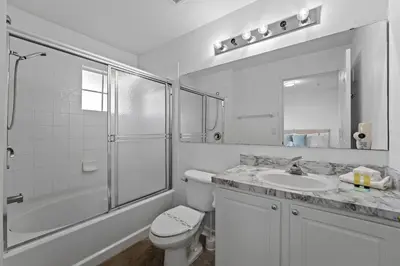 a bathroom with a toilet and a shower and a sink at SUPER YES - MANY AMENITIEs RELAX GYM COURTs in Kissimmee
