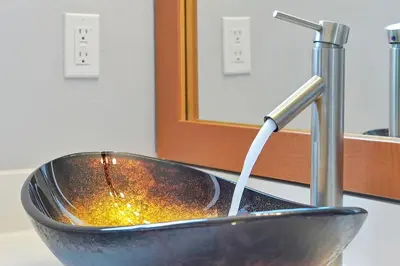 a bathroom sink with a water faucet and a sink at Encantada Resort - Spacious 3-Bedroom Villa with Private Pool Near Disney in Kissimmee