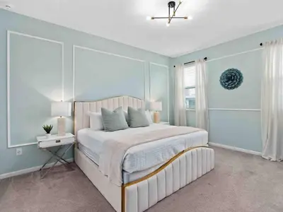 a bedroom with a large bed and a window at SUPER JUMBO - 12BD 12BAs SLEEPs 34 - w AMENITIEs in Kissimmee
