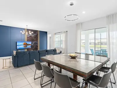 a living room with a table and a couch at SUPER SPACE - 12BD 12BA - MANY ENSUITEs SLEEPs 38 in Kissimmee