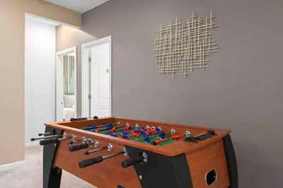 a game room with a foos ball on a table at SUPER FANCY- 15BDR 17BAs HUGE 7 000SQFT HOME in Kissimmee