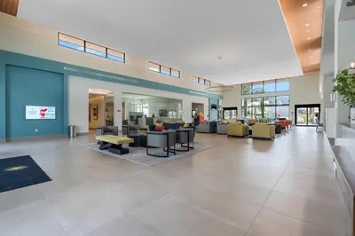a lobby of a hospital with couches and chairs at SUPER CIELO - 12BDR 11BAs - FUN THEME w POOL in Orlando