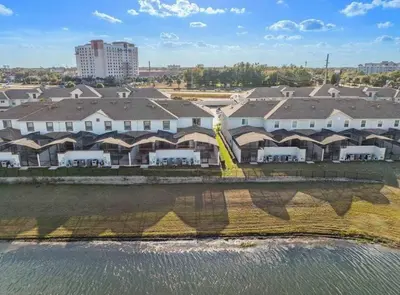an aerial view of a resort near the water at Super Chill - 5 Bedrooms WPOOls in Kissimmee
