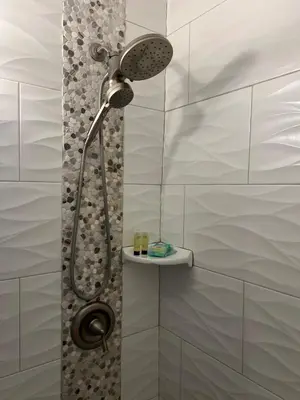 a bathroom with a shower with a shower head at City and Stadium Sanctuary Vibes in Orlando