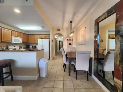 a kitchen and dining room with a table and chairs at Orlando 1st Floor - 5 min Disney in Orlando