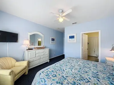 a bedroom with a bed and a ceiling fan at Two Bedroom Condo near Disney condo in Kissimmee