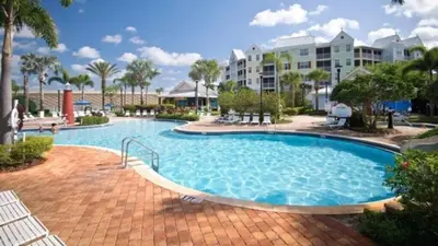 a large swimming pool in a resort at Two Bedroom Condo near Disney condo in Kissimmee