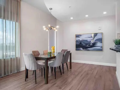 a dining room with a table and chairs at PentHouse Downtown Orlando 2 Beds 2 baths in Orlando