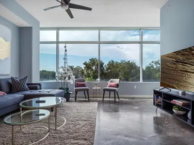 a living room with a couch and a table at Luxurious 2 Beds 2 Baths Downtown Apartment in Orlando