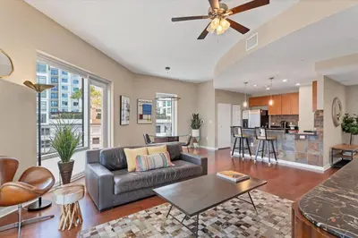 a living room with a couch and a table at Beautiful Downtown Condo 1 Bed 1 Bath in Orlando