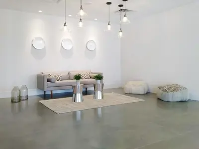 a living room with a couch and a table at Modern- 2 Queen bed suite with pool near Disney World in Kissimmee