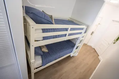 a bunk bed with blue pillows in a room at Orlando Blue Heron 1 Mile From Disney 11th floor in Orlando