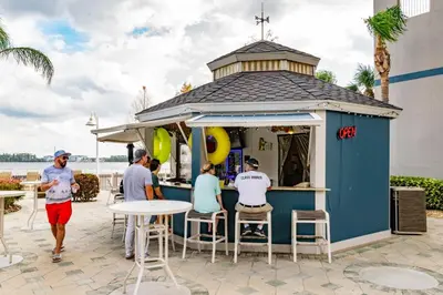a group of people standing around a food cart at Orlando Blue Heron 1 Mile From Disney 11th floor in Orlando