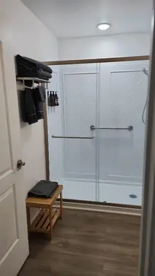 a bathroom with a shower and a walk in closet at Orlando Blue Heron 1 Mile From Disney 11th floor in Orlando