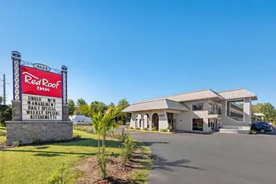 a sign in front of a red roof inn at Red Roof Inn Kissimmee, FL in Kissimmee
