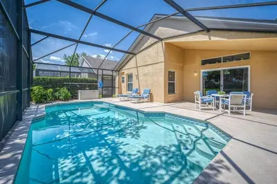 a swimming pool in a house with a glass ceiling at Flash 20 Off Private Pool Home at Lake Berkley Resort in Kissimmee