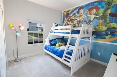 a bedroom with a bunk bed and a mural at Flash 20 Sale Pvt Pool Townhome at Storey Lake in Kissimmee