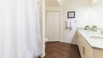a bathroom with a shower and a toilet and a sink at Special Offer Elegant Townhome at West Lucaya in Kissimmee