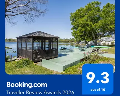 a gazebo next to a body of water at Lakefront Retreat - Boat - Fish - Close to all Orlando Parks - Disney - Universal - SeaWorld in Orlando