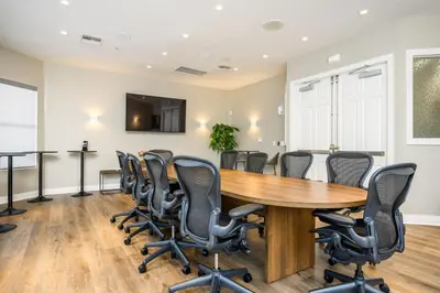 a conference room with a wooden table and chairs at New Modern Vista Cay Reserve Condo - 6007 in Orlando