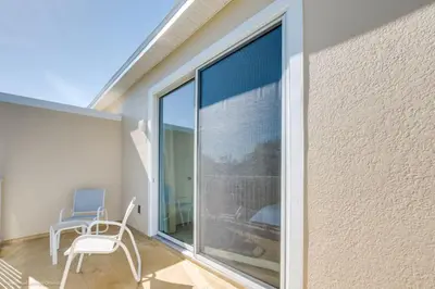 a room with a large window and a chair at Special Offer Luxury Retreat with Pool in Orlando