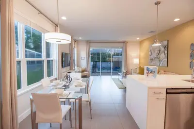 a kitchen and dining room with a table and chairs at Special Offer Luxury Retreat with Pool in Orlando