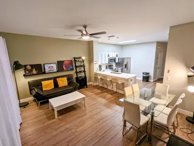 a living room with a couch and a table at New Luxury Disney Townhome at Windsor Hills Resort, 3BED 3BATH, Private Pool Parking WiFi Included in Orlando