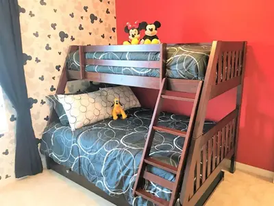a bunk bed with a ladder in a bedroom at Special Offer Townhome at Compass Bay in Kissimmee
