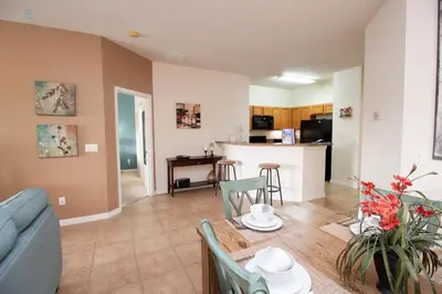 a living room with a couch and a table at Special Offer Townhome at Oakwater Resort in Orlando
