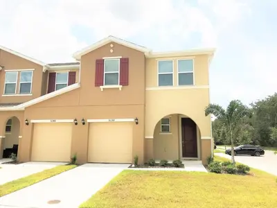 a large house with a garage at TVPM5150CHCB in Kissimmee
