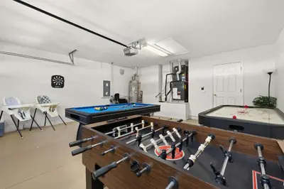 a room with a ping pong table and a pool table at 373 - Stunning 4 Bedroom Villa with own Private South East Facing Pool in Orlando