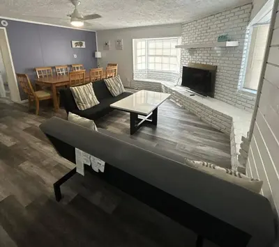 a living room with a couch and a fireplace at Welcome to Altamonte Springs! in Orlando