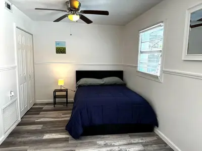 a bedroom with a bed and a ceiling fan at Welcome to Altamonte Springs! in Orlando